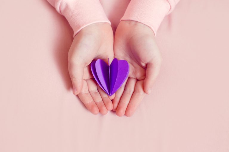 Epilepsy Awareness Childs Hands Holding Purple Hearts